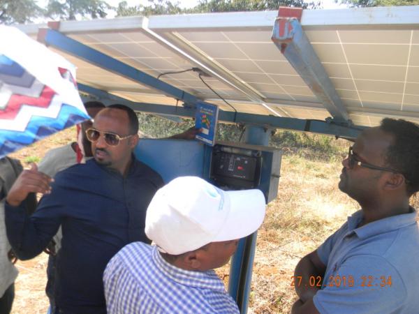 Mesfin Gerenew, Civil and Water works engineer for World Vision Ethiopia, explains the SQ Flex Solar Pump during a joint program monitoring visit to the Hamusit school in the Dera District.