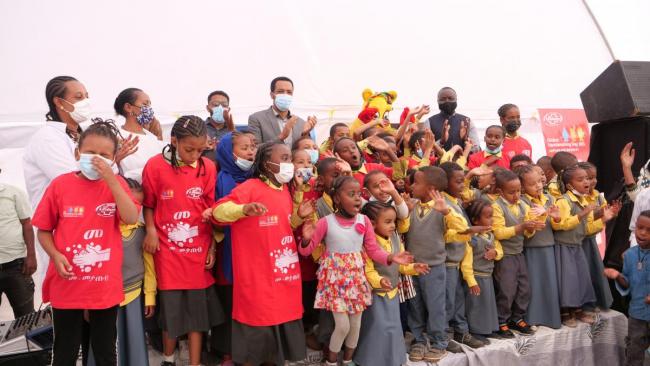 Schoolchildren singing songs about handwashing