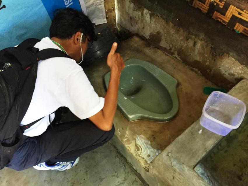 Taking a picture of a toilet in the SEHATI project
