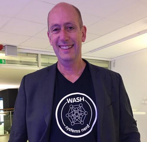 IRC's CEO Patrick Moriarty wearing a WASH systems nerd t-shirt