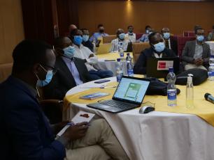 Multi-stakeholder platform meeting in Ethiopia, participant on the left is using Telegram on his computer