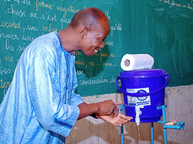 Mayor of Tenkodogo visiting a school for the municipality's annual hand-washing campaign 