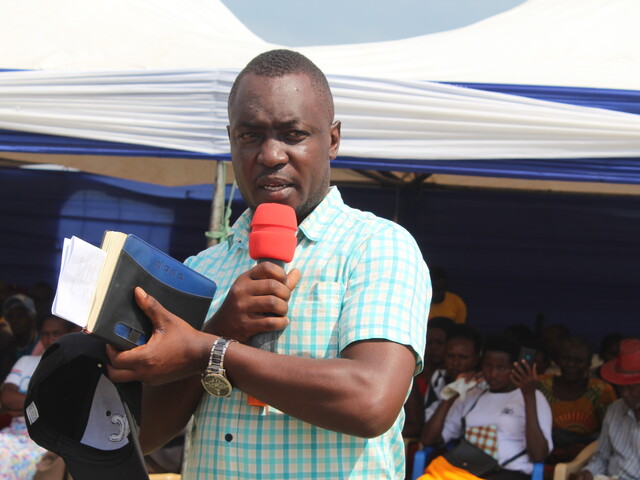 Peter Dauda Bazira, District Councillor for Kicwamba Sub County, speaking at a community event in th