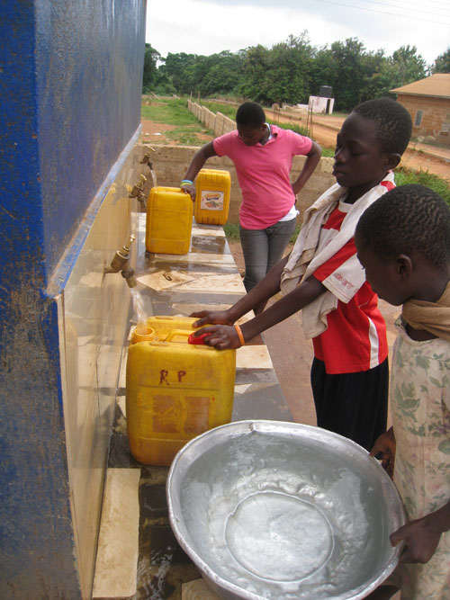 Filling water receptacles in Ghana