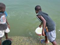 Children fetching water from an informal source-Lake Bosomtwe